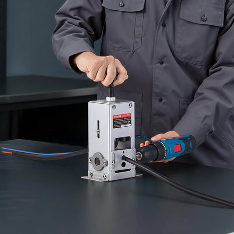 Heavy Duty Wire Stripper Machine with hand crank or drill powered modes in use, stripping copper cable, ideal for small workshops