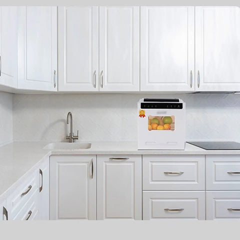 Plug And Go Compact Desktop Dishwasher With Intelligent Drying and Triple Wash Filter in a modern white kitchen.