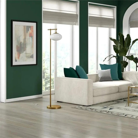 Go To 68 Inch Tall Arc Floor Lamp With Glass Shade In Brushed Brass And Milk White in a modern living room setting.