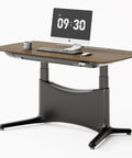 Colamy 55x28 Inch Electric Standing Desk Dual Motor Sit Stand Workstation with walnut top and carbon steel frame.