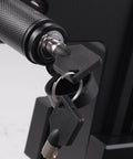 Close-up of a locking mechanism with keys inserted, part of a Five Eighth Inch Trailer Hitch Lock With Extra Long Four And A Half Inch Span For Three Inch Receivers Plus Two And A Half Inch And Two Inch Adapters Anti Rattle O Rings Locking Hitch Pin To Keep Your Trailer Truck Or Car Safe, showing textured grip and metal finish.