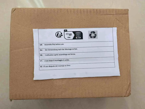 Cardboard box with assembly instructions label in multiple languages, featuring recycling symbol and safety icons.