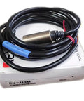 Rock Solid Metal Proximity Switch With Long Reach Amplifier Unit Split Style Setup For Fast PLC Wiring And Industrial Control Systems, featuring cable and connector.