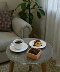16 Inch Marble Lazy Susan Round Stone Rotating Serving Tray with coffee and pastry in living room setting, elegant marble top.