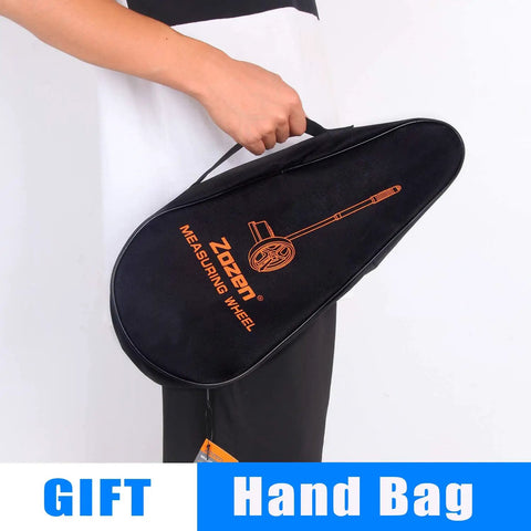 Person holding a carrying bag for Compact 6 Inch Measuring Wheel For Quick Distance Check In Feet On The Job Telescopic Mechanical Wheel One Key Reset Rolling Distance Up To 10,000 Ft Includes Carrying Bag And Durable TPR Tires