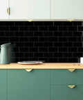 Subway Tile Peel And Stick Backsplash Star White Marble PVC Self-Adhesive Tiles Pack on kitchen wall with green cabinets.