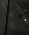 Close-up of black Stability Plus Wide Body English Stirrup Leathers with slim buckle design featuring premium calfskin detail.
