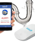 Smart Water Leak And Freeze Detector With WiFi Alerts, 80dB Audible Alarm next to a leaking sink pipe showing alert on a phone.