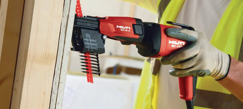 High Speed Drywall Screwdriver SD 4500, 120V 740W in use with magnetic bit holder, depth gauge visible, installing drywall.