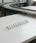 Flat Compression Spring Set Stainless Steel 2 Pcs For Industrial Machinery, Trapezoidal Wire Form, High Strength, Easy Install, Square Flat And Rectangular Coil Design, Pro Grade For Mechanical Applications And Spare Parts on conveyor