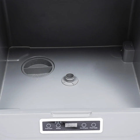 Interior view of Compact Countertop Dishwasher With Four Wash Cycles Optimized For Small Kitchens, featuring wash basin and control panel.