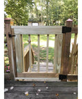 Installed Self Closing Gate Hardware Kit with Self Locking Gate Latch and Heavy Duty Spring Hinges on a Wooden Fence