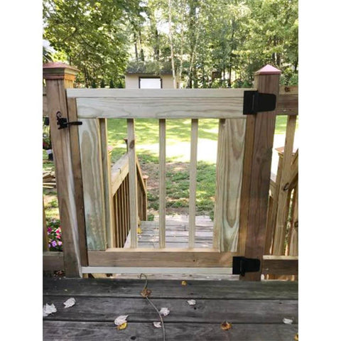 Installed Self Closing Gate Hardware Kit with Self Locking Gate Latch and Heavy Duty Spring Hinges on a Wooden Fence