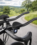 Triathlon T Handlebar Aerobars for road bikes shown on a bike with beefy aluminum alloy build rest pads and cushions.