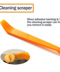 Orange plastic cleaning scraper tool with adhesive tip, easy to remove 3M backing, shown in detail view.