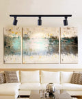 12 Pack LED Track Lighting Heads Adjustable 350 Horizontal 90 Vertical 6.5W 3000K Warm White 500lm Each Dimmable With TRIAC ETL Listed Universal 120V Single Circuit H Type Rail Black Painted For Accent Task Wall Art Lighting illuminating modern abstract art above a living room sofa.