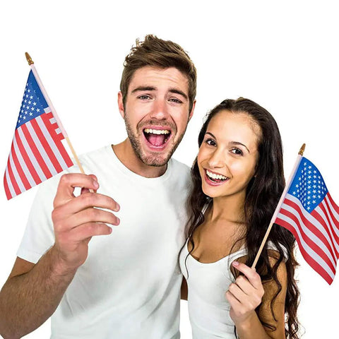 Two people holding Handheld 5x8 Inch American Flags On Wooden Sticks 12 Pack Small US Flags With Safe Spear Tops, smiling