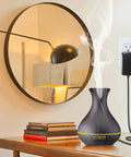 Living room scene with 24V 1A power adapter charger for LED strips, fish tanks, massage guns and more connected to wall outlet