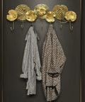 Swanky Wall Mounted Coat Rack Featuring Solid Metal Hooks Super Durable Entryway Organizer For Jackets Coats Hats Towels And Keys with two coats hung.