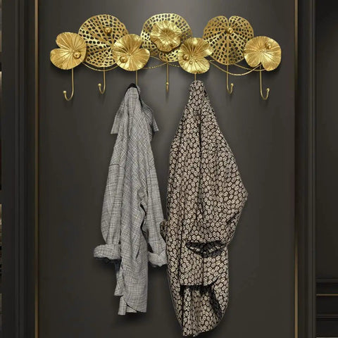 Swanky Wall Mounted Coat Rack Featuring Solid Metal Hooks Super Durable Entryway Organizer For Jackets Coats Hats Towels And Keys with two coats hung.