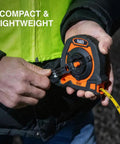 Person using Closed Reel Tape Measure With 100 Foot Nylon Coated Blade Fast Three To One Gear Retracting Smooth Release Button