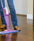 Heavy Duty Washable Microfiber Cleaning Pad Fits Standard Floor Mops in use on shiny wood floors trapping dirt and dust.