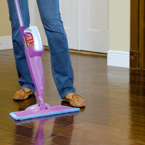 Heavy Duty Washable Microfiber Cleaning Pad Fits Standard Floor Mops in use on shiny wood floors trapping dirt and dust.