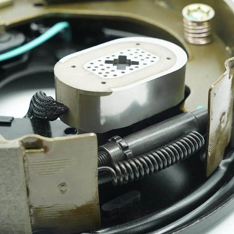 Close-up of 12x2 Inch Electric Trailer Brake Magnet Kit for 5200 to 7000 lbs Dexter type with retainer clips and coil springs.