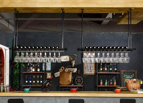 Buttery Smooth Stainless Steel Concealed Pivot Hinge Handles Heavy 70 Kilogram Loads With A Full 180 Degree Swing Perfect For Your Built In Closet Doors And Tough Furniture Jobs on a stylish bar with glassware.