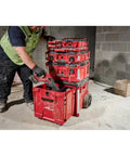 Impact Tool Box With Rolling Drawer For Heavy Duty Jobs, Red, One Handed Opening, 250 Pound Capacity, in use at a construction site.
