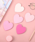 Pink Heart Index Cards Pack, 150 Count, 3x3 Inch Note Cards for School, Study, Office, and Games on pink surface with pen and glasses