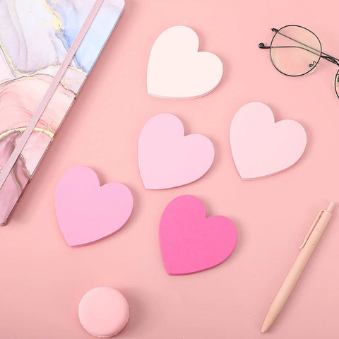 Pink Heart Index Cards Pack, 150 Count, 3x3 Inch Note Cards for School, Study, Office, and Games on pink surface with pen and glasses