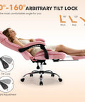 Woman reclined on pink Comfy Reclining Office Chair With Footrest For Women, Wide Seat Big Tall Ergonomic Gaming Desk Chair, demonstrating tilt lock.