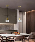 Straight Up Stylish Nordic Modern Marble And Stainless Steel Pendant Ceiling Light With E27 Bulb Socket hanging over a dining table