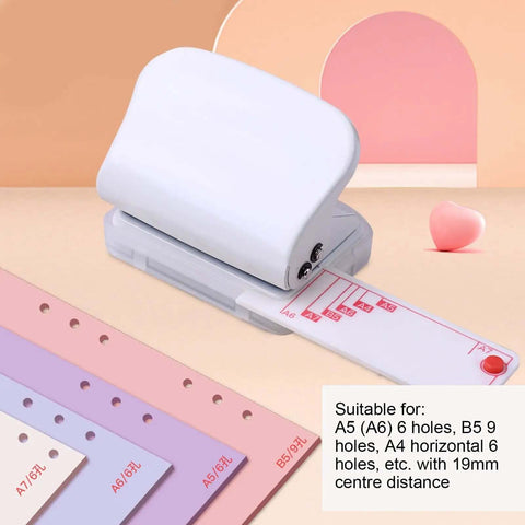 Super Handy Portable 3 Hole Puncher For Loose Leaf Paper A4 A5 B5 With 5 Sheet Capacity And Built In Positioning Ruler displayed on desk