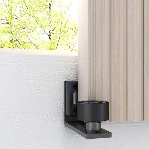 Adjustable Floor Guide For Sliding Barn Doors Black, Wall And Door Bottom Roller Guard, installed on wall, wood door visible