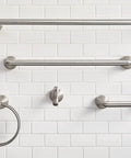 Hamden Spot Resist Brushed Nickel 24 Inch Single Towel Bar on white tiled wall with coordinating fixtures