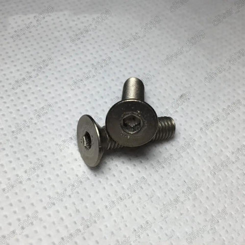 Tough As Nails GR2 Titanium Hex Socket Countersunk Flat Head Screws Yield Smoother Fit With Tight Metric Fine Threads And Rock Solid Protection For Heavy Lift Aerospace Medical Builds In Precise M8 By Forty Five Millimeter Specs Sold Per Box, showcasing two screws.