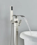 Floor Mounted Tub Filler Faucet With Handheld Sprayer And Waterfall Spout, Free Standing Tub Mixer Tap In Brushed Nickel next to tub
