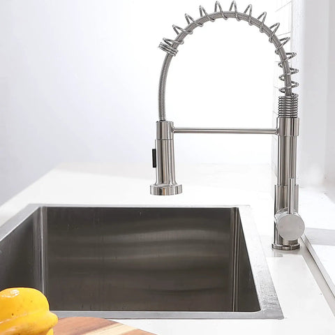 Brushed Nickel Kitchen Faucet With Pull Down Sprayer, Heavy Duty Commercial Style, Single Handle Spring Design over a modern sink