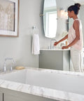 Gibson Chrome Two-Handle Deck Mounted Modern Roman Tub Faucet T961 in sleek boss chrome finish installed in a contemporary bathroom