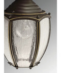 Close-up of Roman Coach Style 1 Light Outdoor Wall Lantern in Textured Black with clear seeded glass detail, classic design.