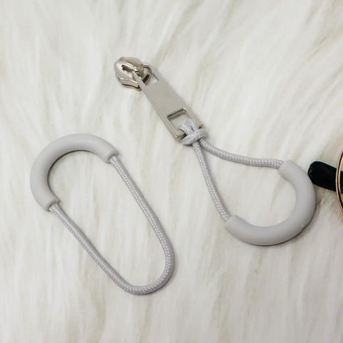 Close-up of 10 Pack Heavy Duty U Shape Zipper Pulls For Backpacks Luggage And Clothes With Nylon Rubber Grip 3Mm Cord in gray.