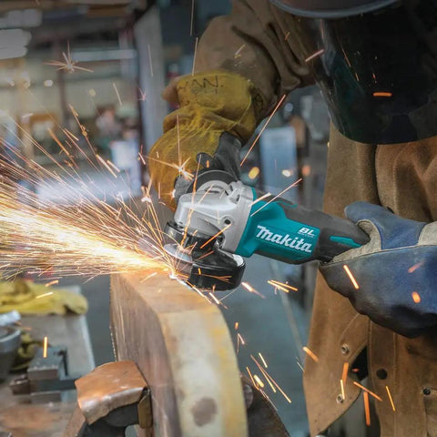 Worker using 18V LXT Brushless Cordless Paddle Switch Cutoff And Angle Grinder for metal cutting with sparks flying