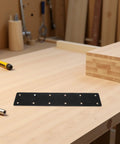Heavy Duty 4 Pack Stainless Steel Flat Mending Plates for Shelf Support and Wood Furniture Fixes on a workshop table