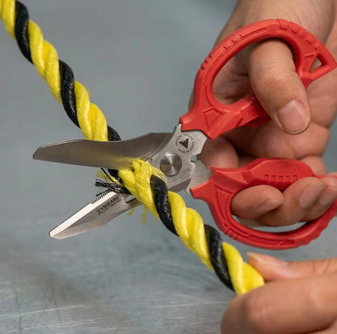 Person using Heavy Duty 6.3 Inch Utility Scissors With 4 in 1 Blade System to cut yellow and black rope. Made in Japan.
