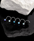 Five Pack 18g ASTM F136 Titanium Nose Studs With Vibrant Opal Tops For Nostril Piercings displayed against a dark surface.
