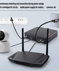 Keep Your Home Net Running Smooth With This Compact Mini UPS For Routers And Modems Housing A Solid 20800 Mah Cell That Hands You Up To 10 Hours Of Unbroken Wifi Right Through Blackouts EU Plug setup with router, camera, and power outlet.