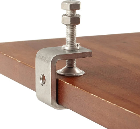 Close-up of Four Piece 304 Stainless Steel C Clamps Heavy Duty Set For Woodworking Welding Building DIY Projects holding wooden board.