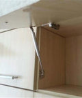 Soft Close Safety Hinges For Toy Box And Furniture Cabinets With Gas Spring Telescopic Rod Iron Head Design installed on a cabinet door